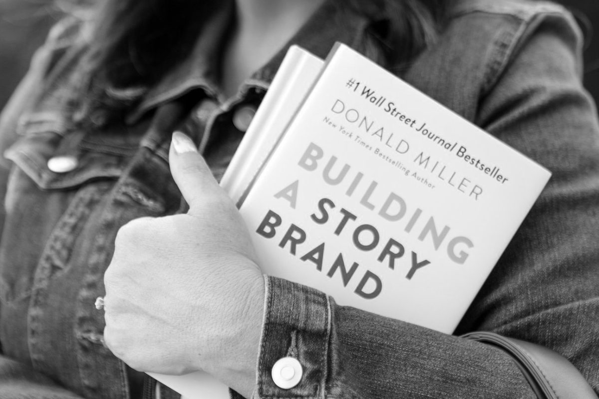 Shannon holding a StoryBrand book