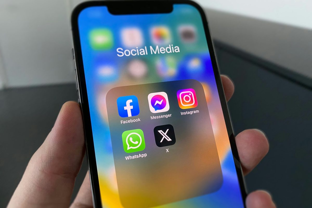scheduling social media content on laptop with colorful content calendar on screen